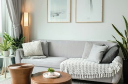a living room filled with furniture and a large window